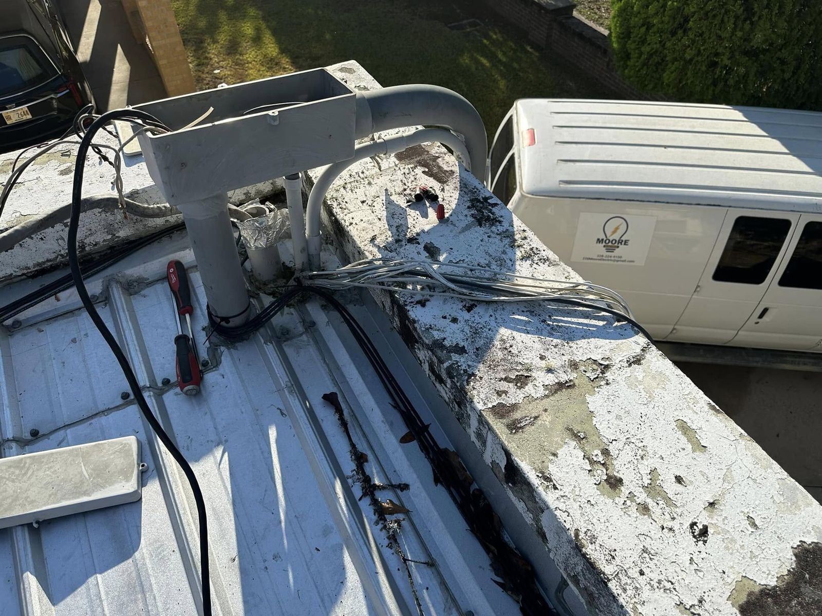 Rooftop electrical work with the Moore Electric van